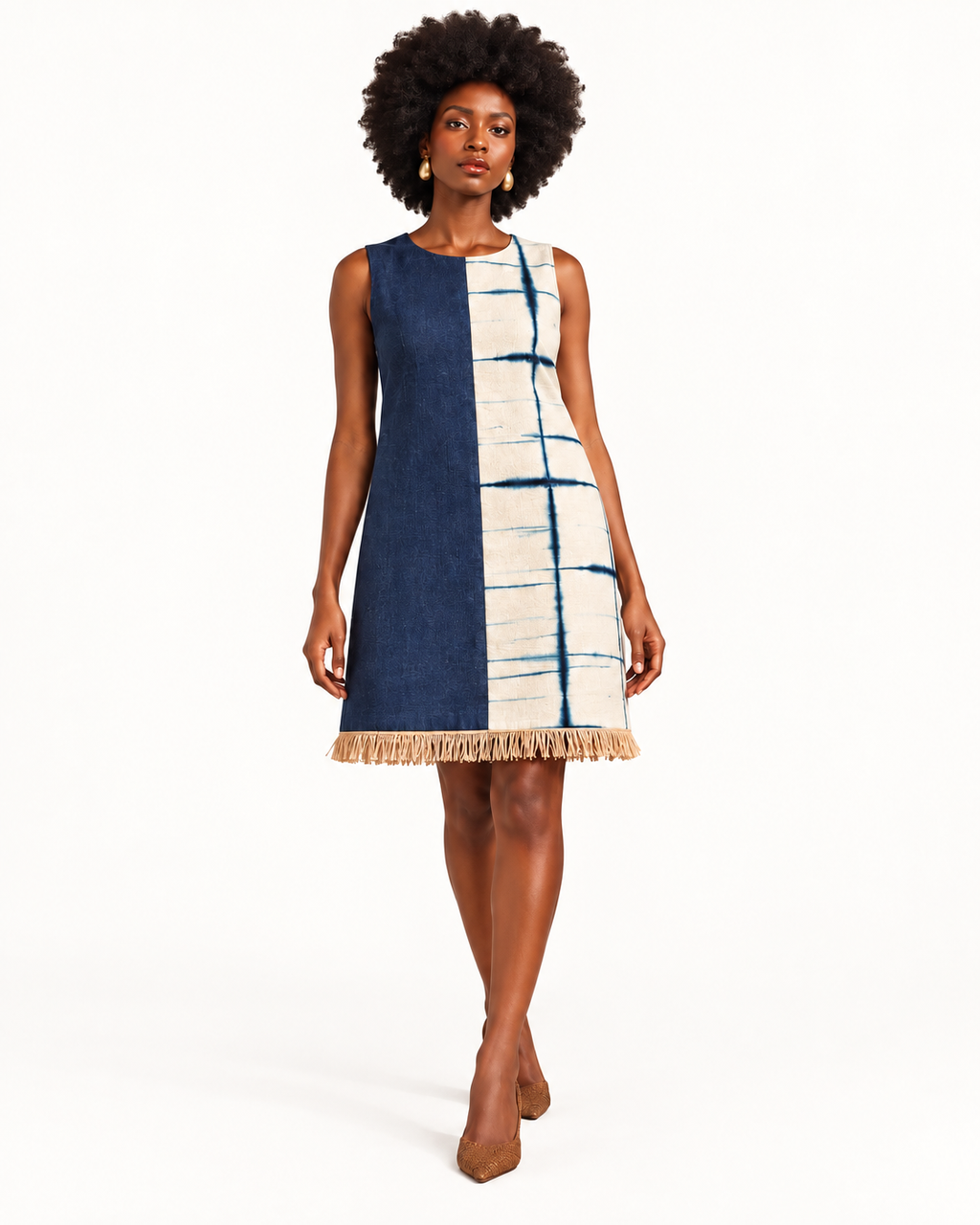 Front view of the Ola Dress, sleeveless with indigo denim, Kano indigo cloth and natural raffia fringe at the hem.
